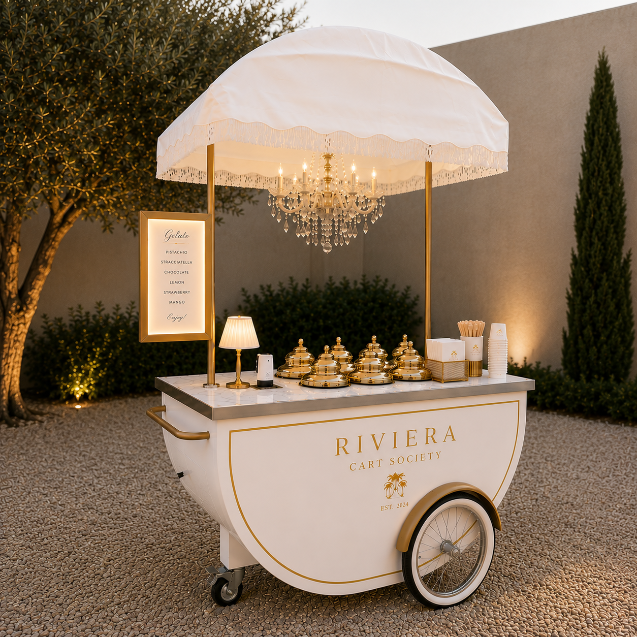 Riviera Cart Society gelato cart with gold-domed vitrines dressed for an event in Nice