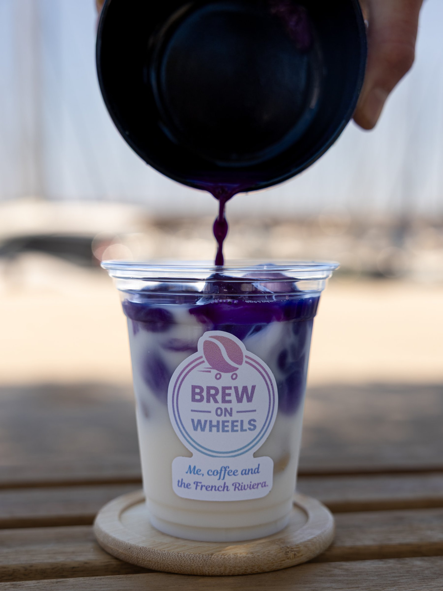 Butterfly pea flower matcha being poured into a Brew on Wheels cup